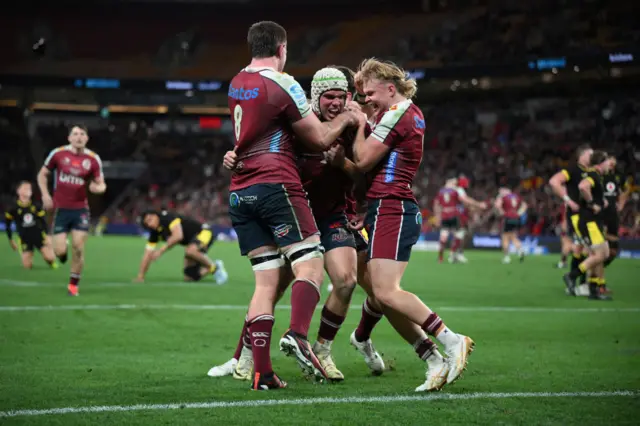 Mac Grealy of the Reds celebrates scoring a try against Wales