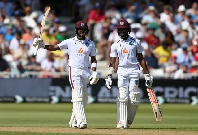 Kavem Hodge of the West Indies celebrates reaching his half century alongside teammate Alick Athanaze during day two of the 2nd Test Match between England and the West Indies at Trent Bridge