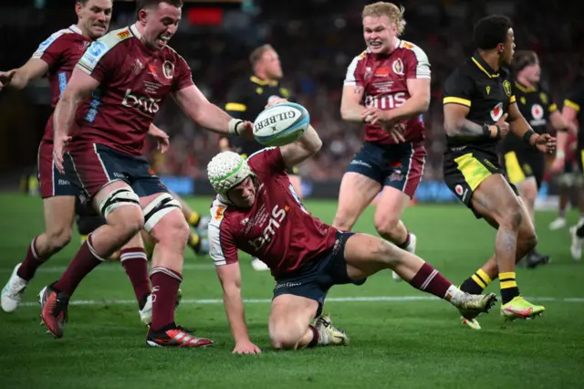 Mac Grealy of the Reds scores a try against Wales