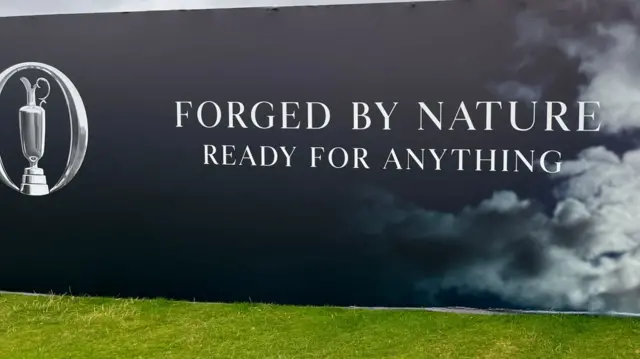 A sign saying 'forged by nature ready for anything' at The Open