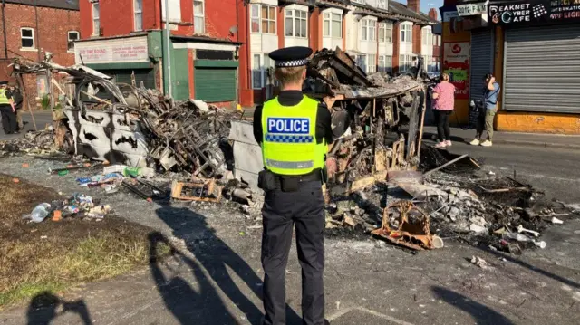 The burnt-out bus in Harehills