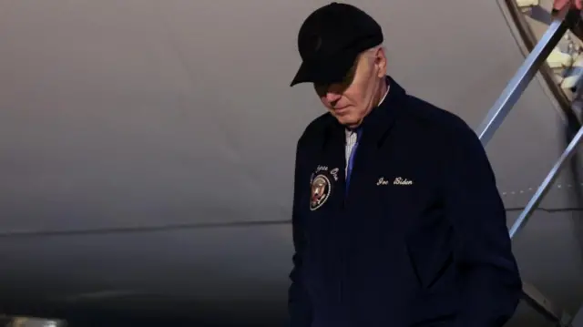 Joe Biden descends the steps of Air Force One