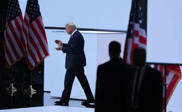 Donald Trump walks on stage at the Republican convention