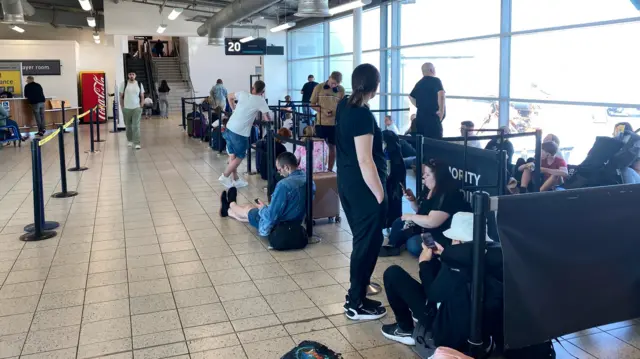 People waiting at Luton airport