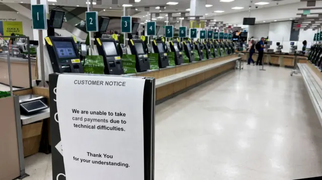 A sign in Waitrose which reads: "We are unable to take card payments due to technical difficulties".