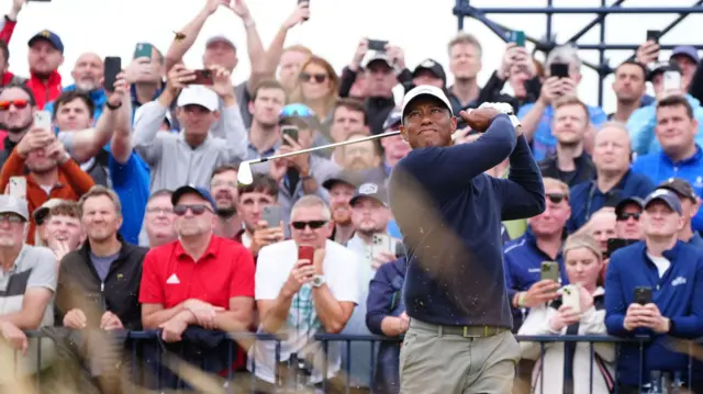 Tiger Woods in front of a packed grandstand