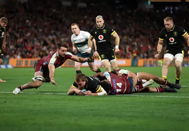 Wales' Nick Tompkins scores a try