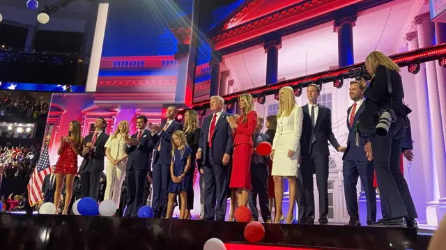 Donald Trump and his family on stage