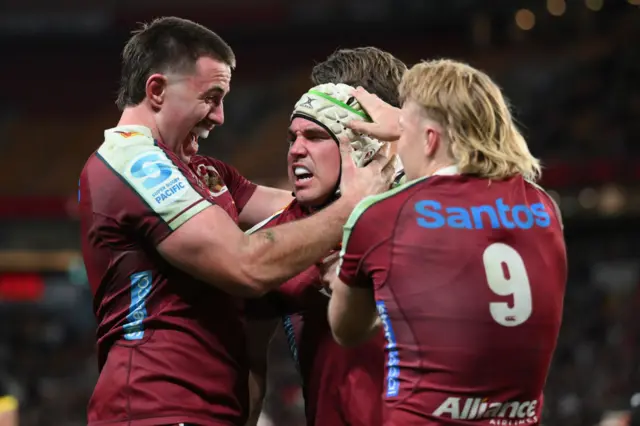 Mac Grealy of the Reds celebrates scoring a try