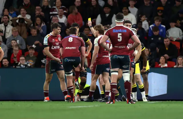 Wales' Evan Lloyd is yellow carded