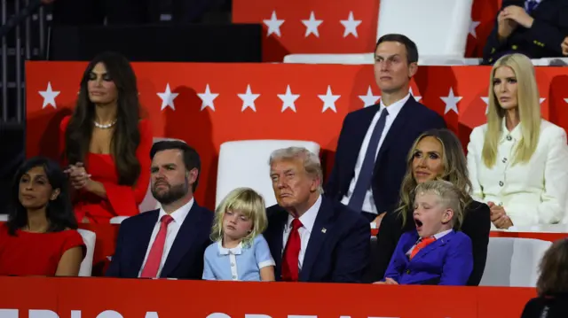 Republican presidential nominee and former U.S. President Donald Trump, Lara Trump, Eric Luke Trump, Carolina Dorothy Trump, Republican vice presidential nominee J.D. Vance and Usha Chilukuri Vance listen as Eric Trump speaks