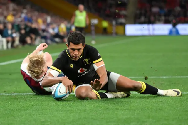 Rio Dyer scores a try for Wales