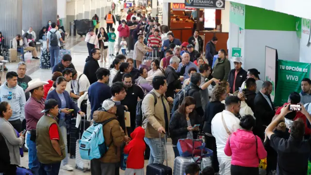 Travellers line up at the Mexico City International Airport