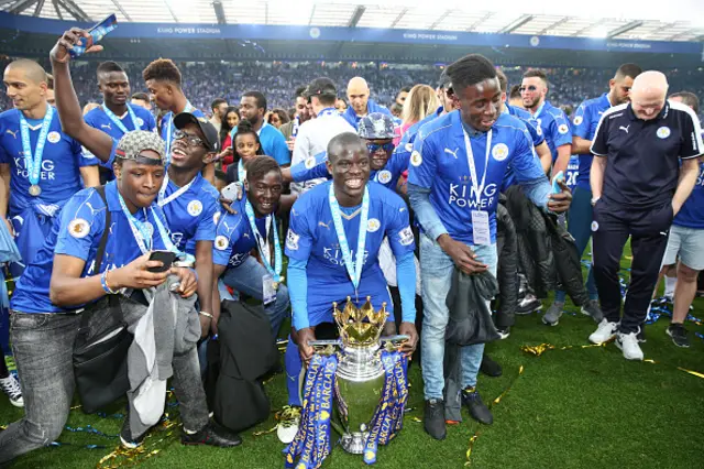 N'Golo Kante of Leicester City celebrates with the Premier League trophy at the King Power Stadium