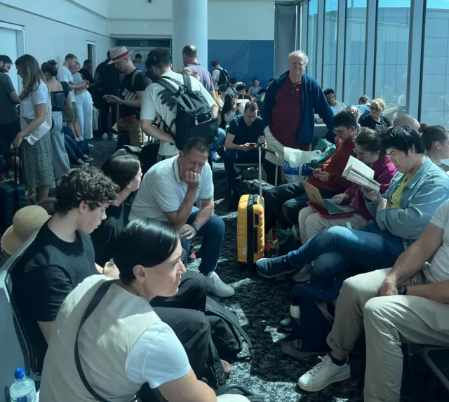 People waiting at London Gatwick airport