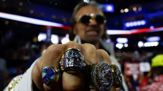 A Trump supporter wears a Trump ring