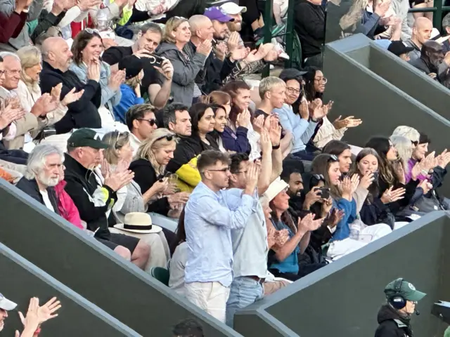 Two men clapping