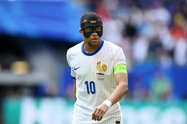 Kylian Mbappe of France looks on