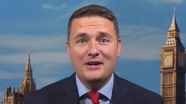 Wes Streeting speaking on BBC Breakfast with a photo backdrop of Big Ben and Houses of Parliament behind him