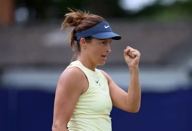 Tatjana Maria holds up her fist in celebration