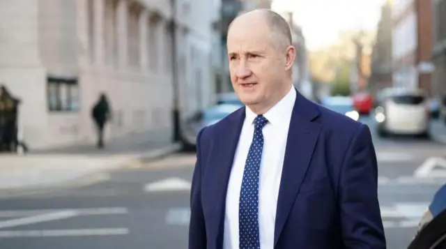 Post Office minister Kevin Hollinrake leaves the Millbank Studios in Westminster, central London.