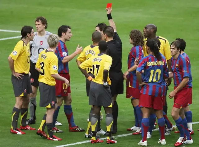 Jens Lehmann (2nd L) receives a red card