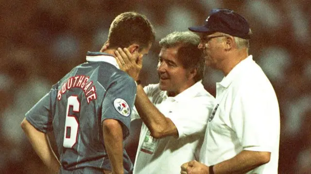 Gareth Southgate is consoled by England manager Terry Venables and coach Don Howe after missing a penalty against Germany at Euro '96