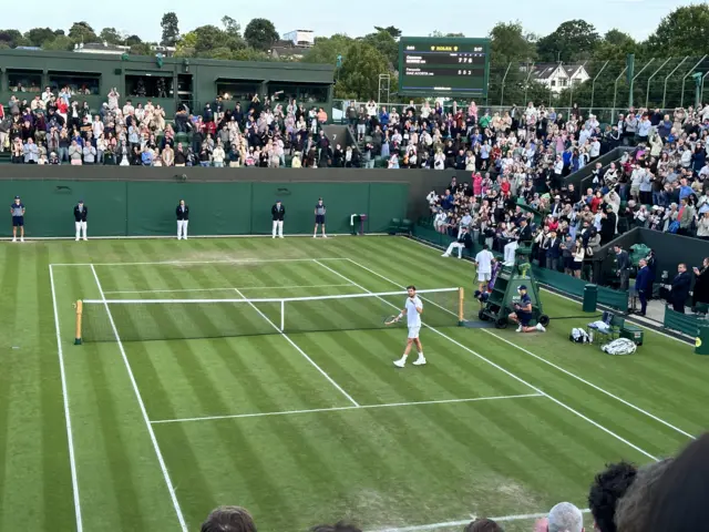 Cam Norrie waving