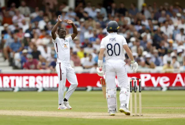 Shamar Joseph reacts after an unsuccessful appeal against Ollie Pope