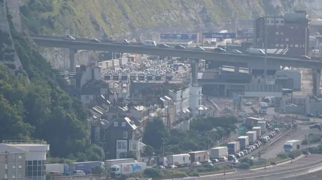 A landscape shot of queues of vehicles leading towards Port of Dover check-in