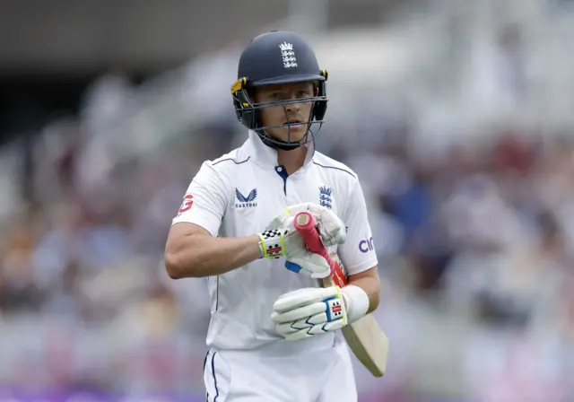 England's Ollie Pope walks after losing his wicket, caught by Kevin Sinclair off the bowling of West Indies' Alzarri Joseph