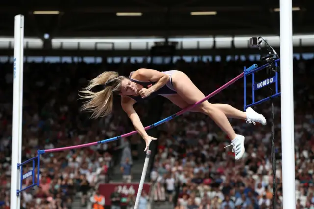 Molly Caudery vaults over the bar