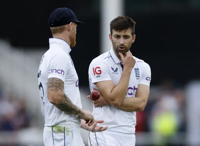 England's Mark Wood with Ben Stokes