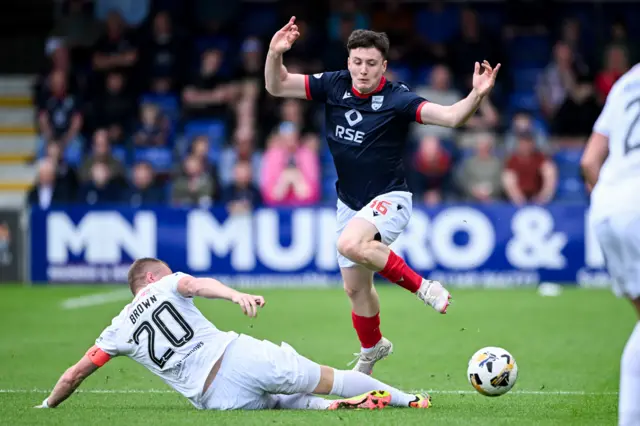 Ross County's George Harmon is tackled by Raith Rovers' Scott Brown