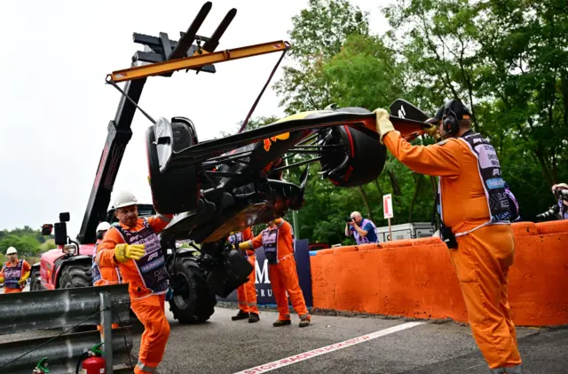 Sergio Perez's car is taken away