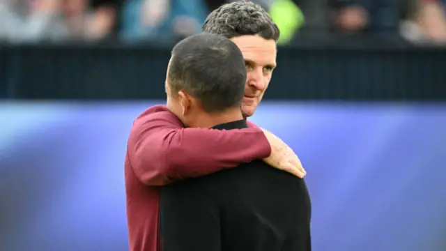 Justin Rose embraces Xander Schauffele