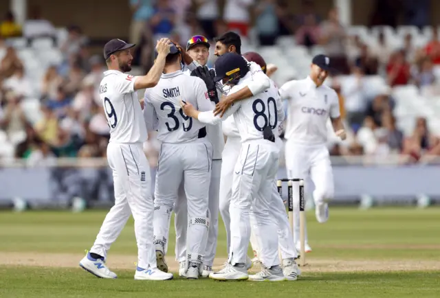 Shoaib Bashir and England celebrate the wicket of Kirk McKenzie