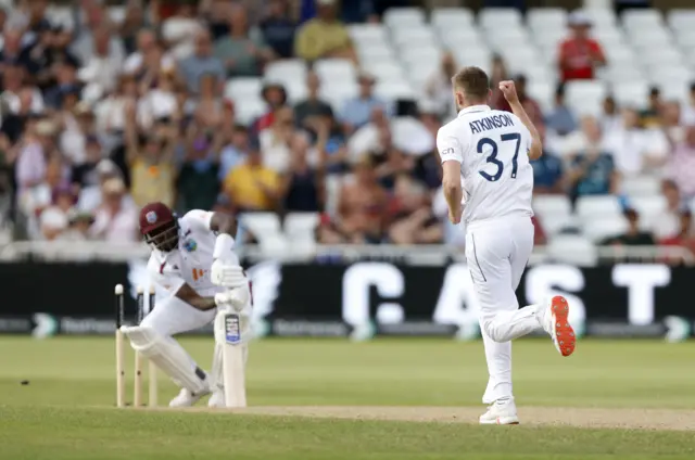 Gus Atkinson bowls Jason Holder