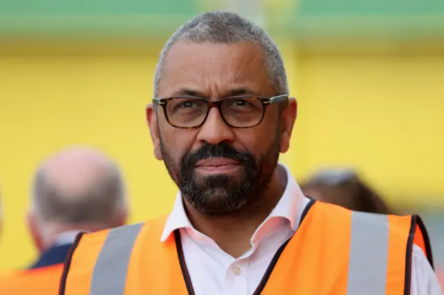 James Cleverly in  high-vis jacket