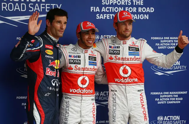 Pole sitter Lewis Hamilton celebrates with second placed Jenson Button and third placed Mark Webber