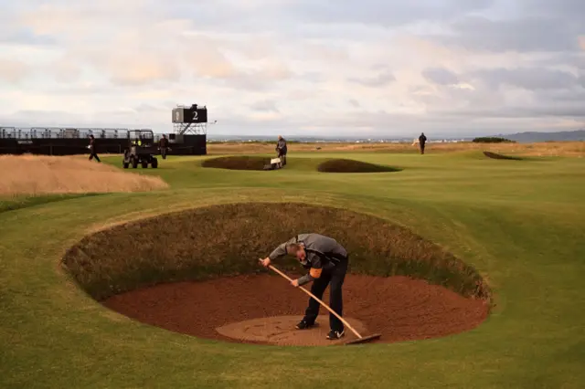 A bunker being raked at Royal Troon on Sunday morning