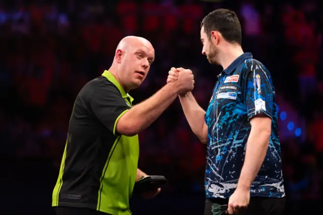 Michael van Gerwen and Luke Humphries shake hands