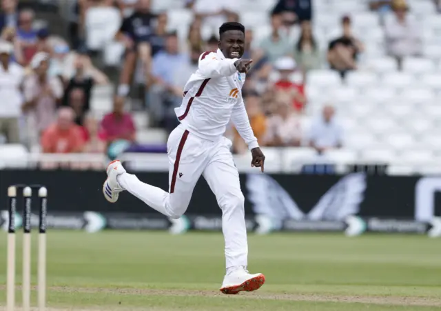 Kevin Sinclair celebrates the wicket of Jamie Smith