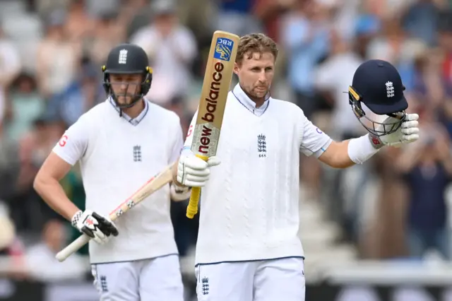 Joe Root celebrates his century