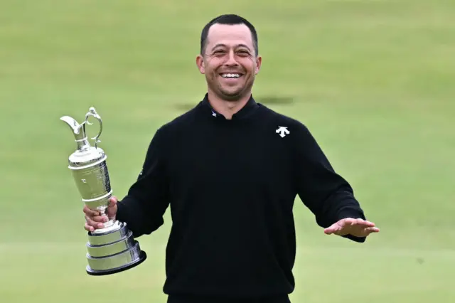 Xander Schauffele holds the Claret Jug