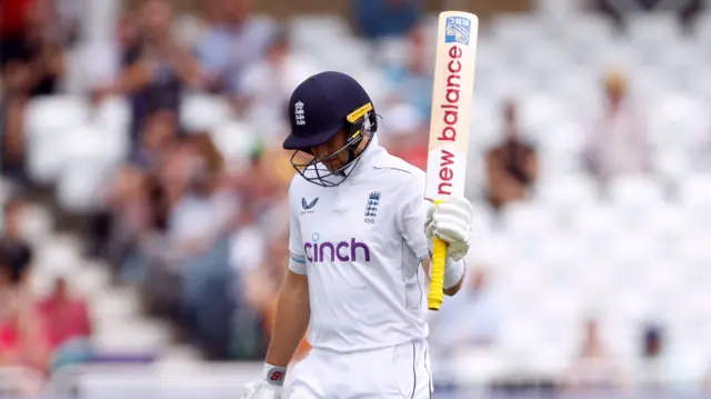 Joe Root celebrates his half-century