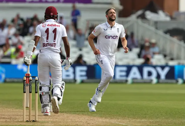 Chris Woakes celebrates the wicket of Kraigg Brathwaite