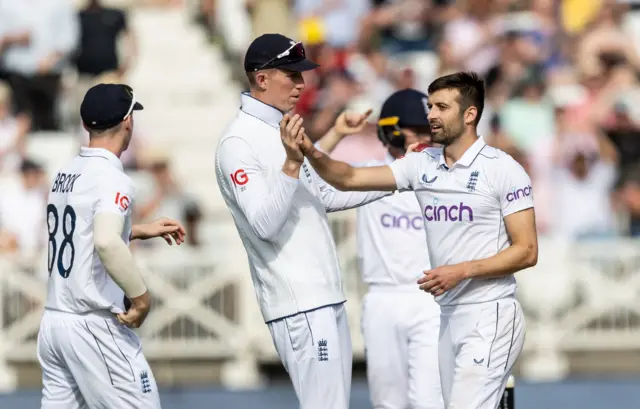 Mark Wood celebrates the wicket of Kevin Sinclair