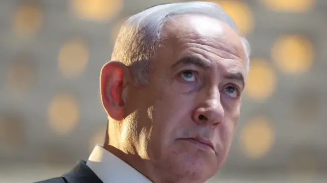 Israeli Prime Minister Benjamin Netanyahu looks up