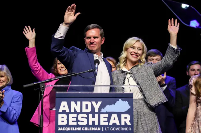 Kentucky Governor Andy Beshear waves with his wife Britainy Beshear and Lt. Gov. Jacqueline Coleman, at left, after winning a second term as Kentucky's Governor during a post election party in Louisville, Kentucky, U.S. November 7, 2023.